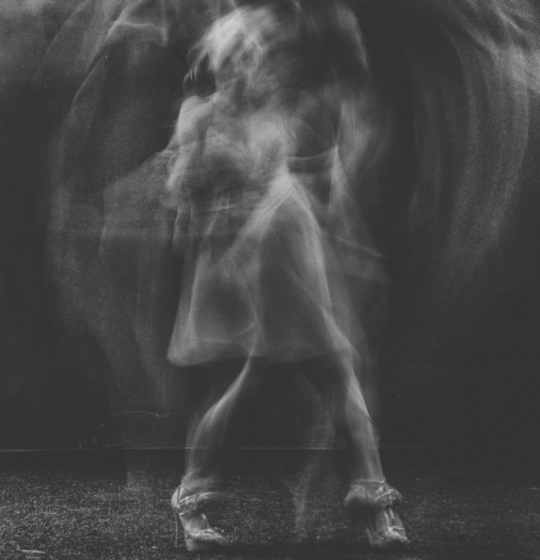 Black and White Photo of Woman Dancing